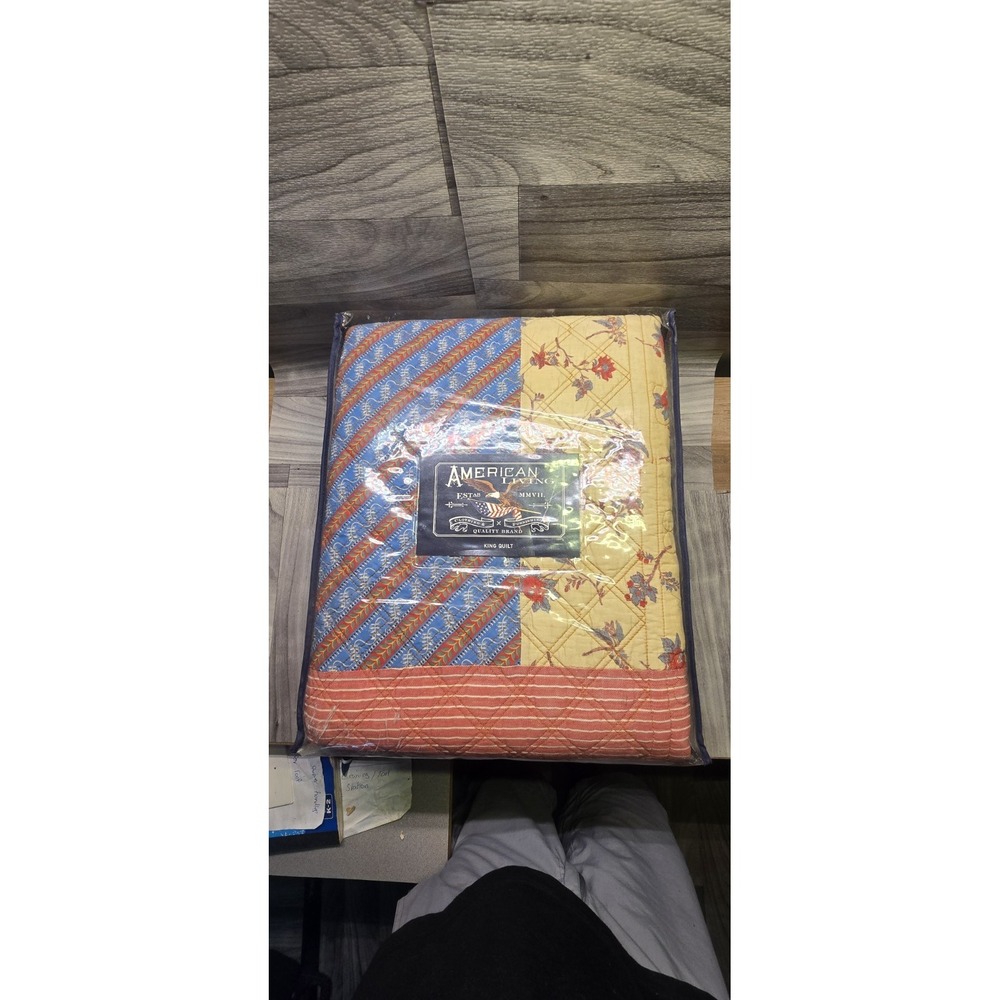 American Living king quilt in a blue and yellow patchwork floral pattern